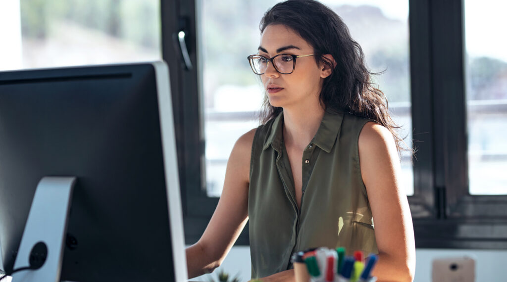 Woman looking at TradeCentric's Amazon Business integration