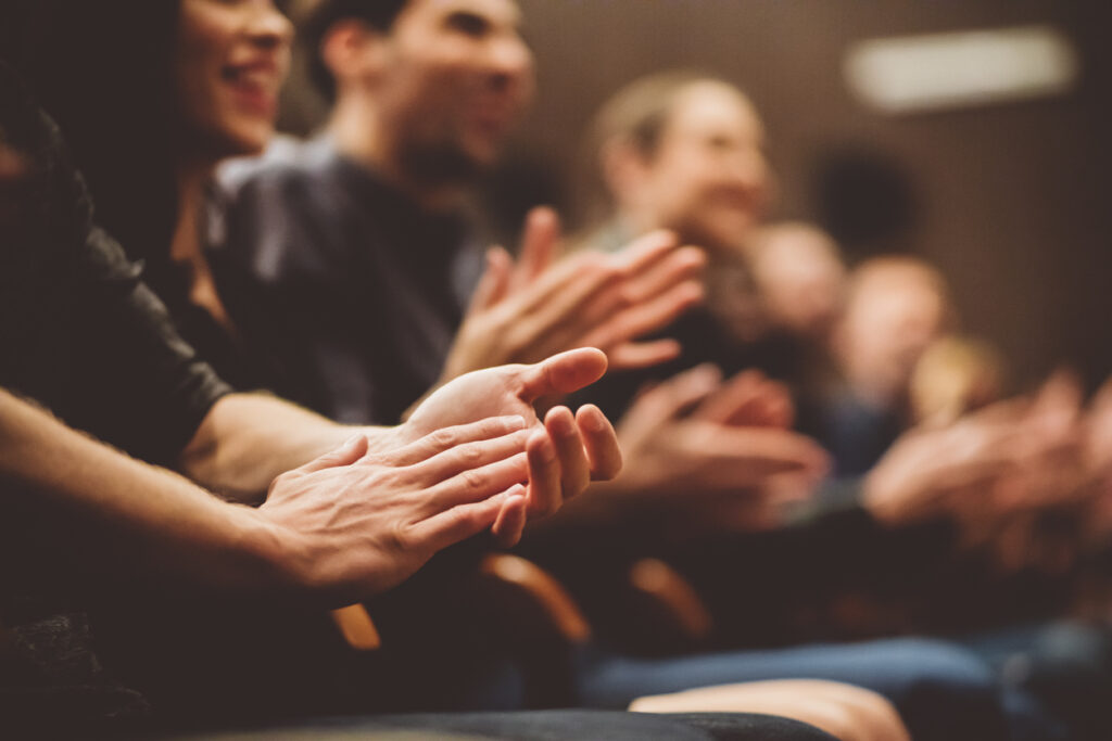 Audience applauding in the theater